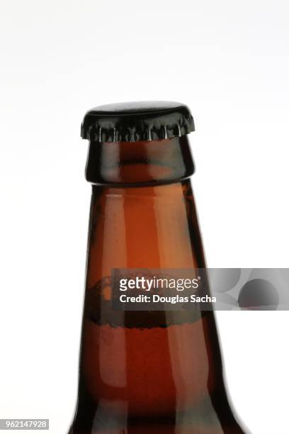close-up of a longneck beer bottle on a white background - natale stockfoto's en -beelden