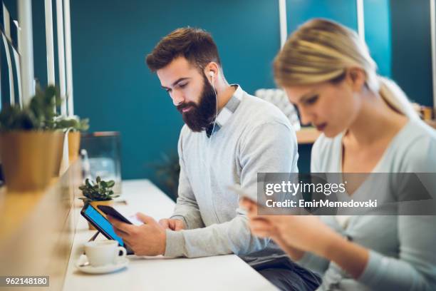 using all latest technology to keep in touch with friends - keep in touch stock pictures, royalty-free photos & images