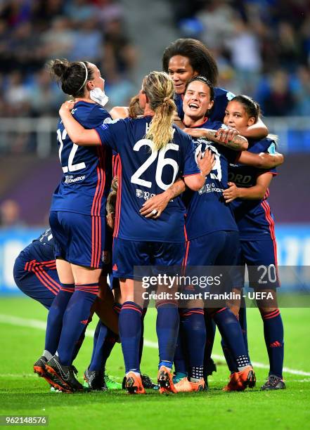 Camille Abily of Lyon celebrates scoring her sides fourth goal with team mates during the UEFA Womens Champions League Final between VfL Wolfsburg...