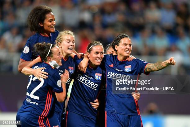 Camille Abily of Lyon celebrates scoring her sides fourth goal with team mates during the UEFA Womens Champions League Final between VfL Wolfsburg...