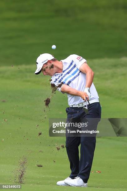Emiliano Grillo of Argentina plays his second shot on the 18th hole during round one of the Fort Worth Invitational at Colonial Country Club on May...