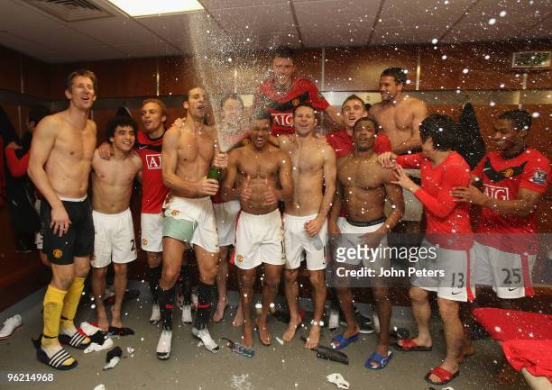 The Manchester United squad celebrate in the dressing room after the Carling Cup Semi-Final Second Leg match between Manchester United and Manchester...