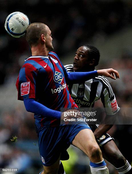 Newcastle player Nile Ranger challenges Clint Hill of Crystal Palace during the Coca-Cola Championship game between Newcastle United and Crystal...