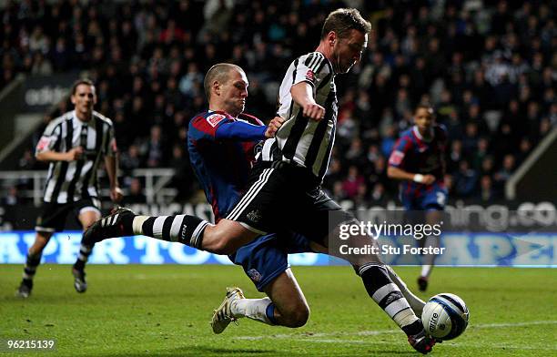 Newcastle player Kevin Nolan is tackled by Clint Hill of Crystal Palace during the Coca-Cola Championship game between Newcastle United and Crystal...