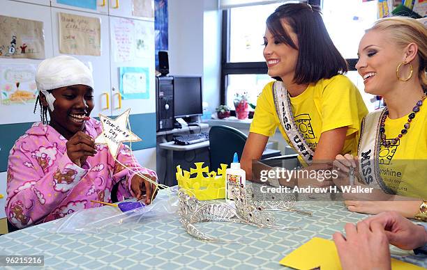 Patient Alicia Cradle, Miss Universe Stefania Fernandez and Miss USA Kristen Dalton participate in Project Sunshine's "Star For A Day" program at...