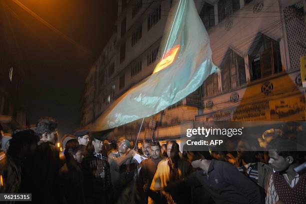 Supporters of the Bangladesh Awami League shout slogan near the central prison in Dhaka on January 27, 2010. Bangladesh at midnight on January 27,...