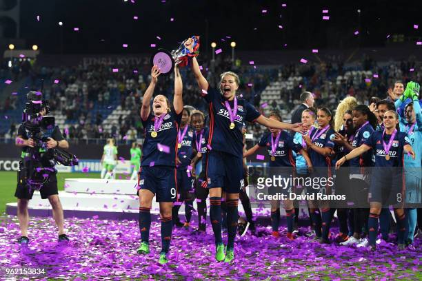 Eugenie Le Sommer and Ada Hegerberg of Lyon celebrate with the trophy during the UEFA Womens Champions League Final between VfL Wolfsburg and...
