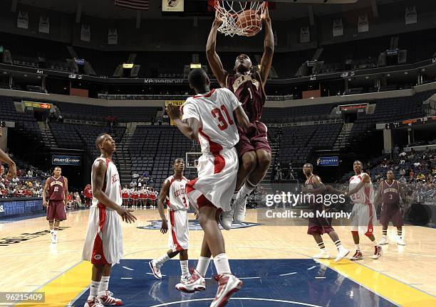 Adonis Thomas of the Melrose Golden Wildcats goes up for a dunk against the Germantown Red Devils on January 17, 2010 at FedExForum in Memphis,...