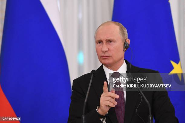 Russian President Vladimir Putin attends a joint press conference with his French counterpart following their talks at the Konstantin Palace in...
