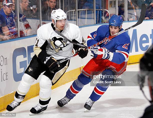 Brian Boyle of the New York Rangers skates against Martin Skoula of the Pittsburgh Penguins on January 25, 2010 at Madison Square Garden in New York...