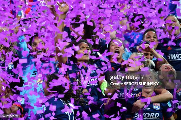 Olympique Lyonnais' French defender Wendie Renard and teammates celebrate their victory after the UEFA Women's Champions League final football match...