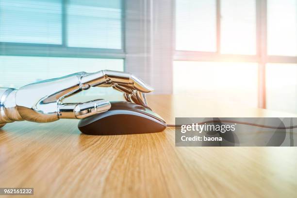 robot's hand using computer mouse - hand mouse overhead stock pictures, royalty-free photos & images