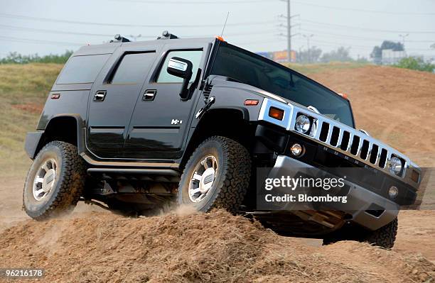 Hummer H2 sport utility vehicle is driven on a test track during a General Motors 2008 model year display at the GM Collection Event, Wednesday,...