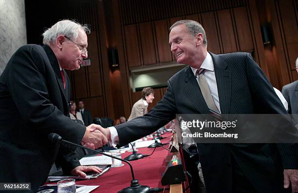 Senate Armed Services Committee Chairman Carl Levin, left, a Democrat from Michigan, greets Retired General James L. Jones, chairman of the Iraqi...