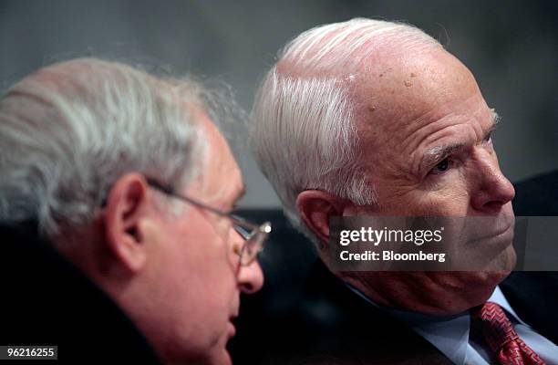 Senate Armed Services Committee Chairman Carl Levin, left, a Democrat from Michigan, confers with Arizona Senator John McCain, during a committee...