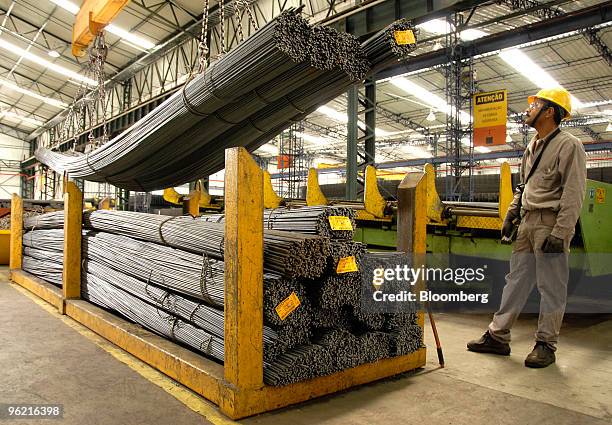 Jose Luis Antunes loads rebar to be shipped at a Gerdau SA steel plant in Sao Jose dos Campos, State of Sao Paulo, Brazil, on Sept. 5, 2007. Cia....