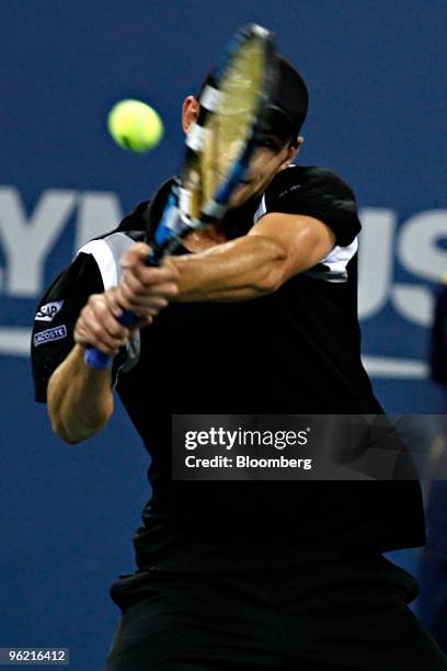 Andy Roddick of the U.S. Returns to Roger Federer of Switzerland during their quarterfinal match on day ten of the U.S. Open at Billie Jean King...