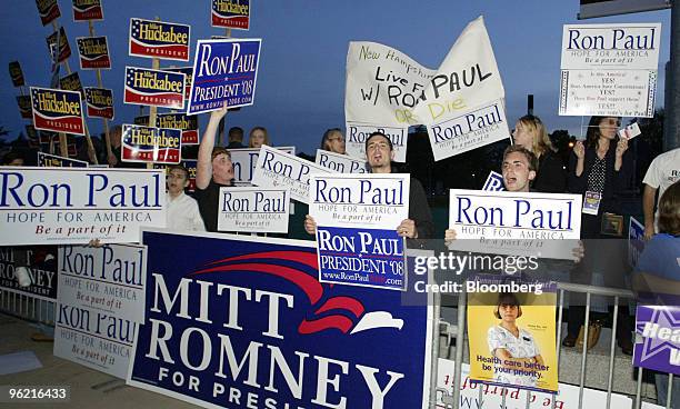 Supporters for Republican presidential candidates hold signs and shout outside the University of New Hampshire prior to the Republican debate in...