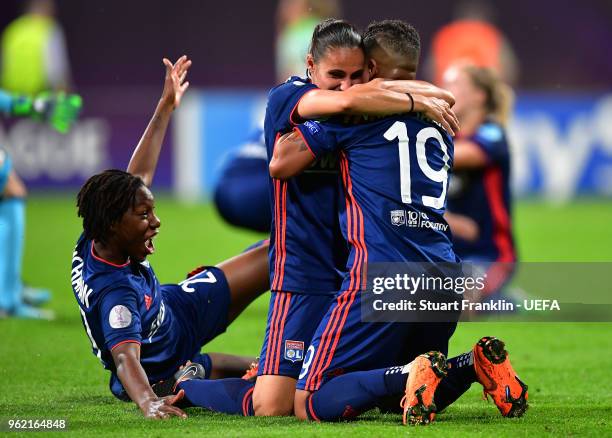 Shanice Van de Sanden, Kadeisha Buchanan and Jessica Houara D'Hommeaux of Lyon celebrate after winning the UEFA Womens Champions League Final between...