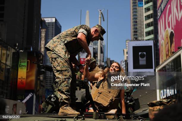 Woman tours a United States Marine military vehicle in Times Square as part of Fleet Week festivities May 24, 2018 in New York City. Fleet Week,...