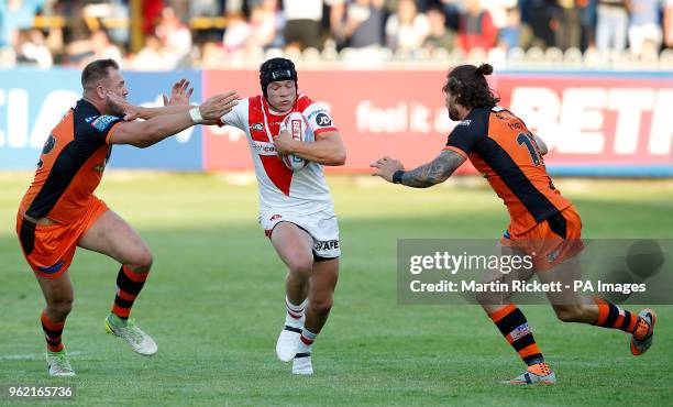 St Helens' Jonny Lomax is tackled by Castleford Tigers Mike McMeeken and Alan Foster during the Betfred Super League match at the Mend-A-Hose Jungle,...