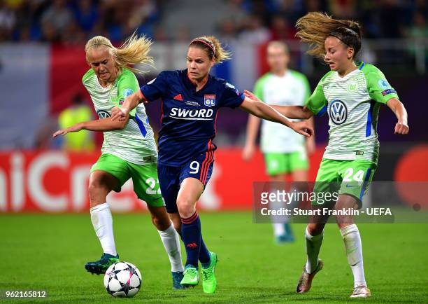 Eugenie Le Sommer of Lyon, Pernille Harder and Joelle Wedemeyer of Vfl Wolfsburg in action during the UEFA Womens Champions League Final between VfL...