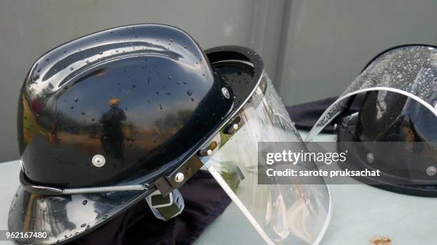 black color fireman hats on table close up .emergency and rescue concept . - crisis response team stock pictures, royalty-free photos & images