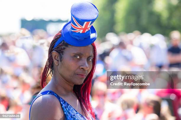 woman wearing a union jack top hat fascinator in the crowds of people lining windsor great park’s ‘long walk’ to celebrate the marriage of meghan markle and prince harry - jack lord stock pictures, royalty-free photos & images