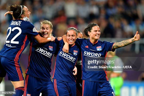 Camille Abily of Lyon celebrates scoring her sides fourth goal with team mates during the UEFA Womens Champions League Final between VfL Wolfsburg...