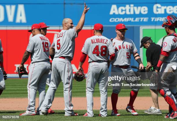 Albert Pujols of the Los Angeles Angels of Anaheim and Kole Calhoun celebrate their victory during MLB game action against the Toronto Blue Jays at...