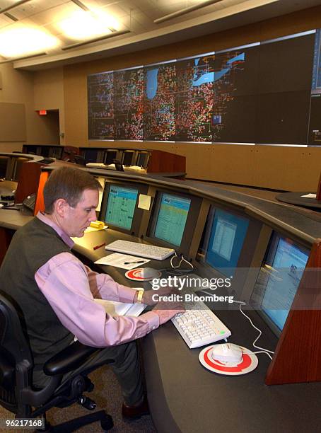 Greg Leach, a tariff administrator for Midwest Independent System Operator works in the control room of the company's Carmel, Indiana facilities,...