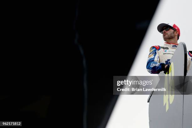 Jimmie Johnson, driver of the Lowe's Patriotic Chevrolet, looks on from the top of his team hauler during practice for the Monster Energy NASCAR Cup...