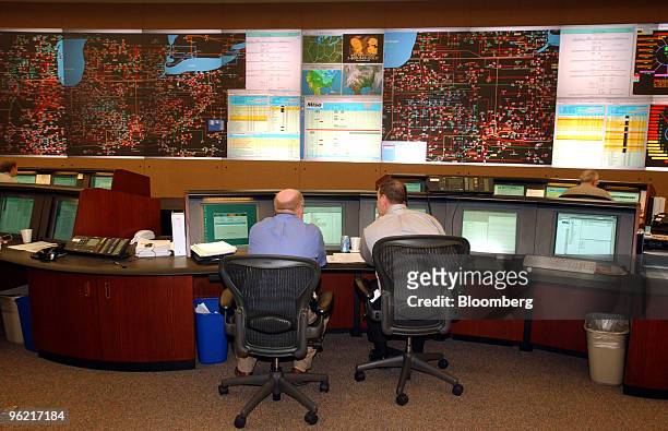 Employees at the Midwest Independent System Operator monitor power grids at the company's Carmel, Indiana facilities, February 18, 2004. The Midwest...