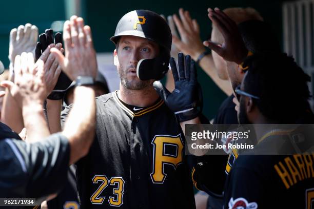 David Freese of the Pittsburgh Pirates celebrates with teammates after hitting a two-run home run in the sixth inning against the Cincinnati Reds at...