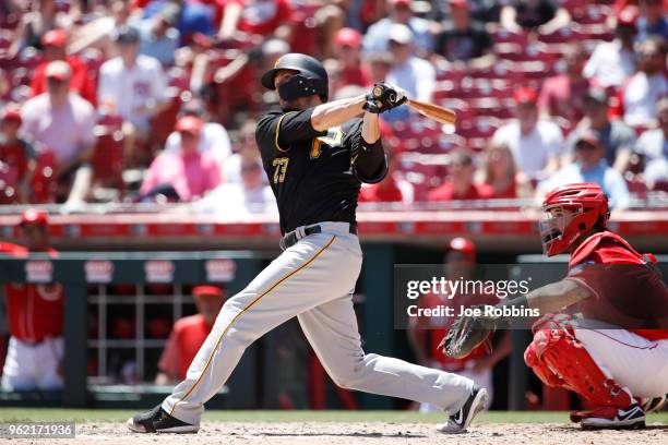 David Freese of the Pittsburgh Pirates hits a two-run home run in the sixth inning against the Cincinnati Reds at Great American Ball Park on May 24,...