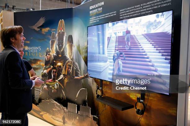 Visitor plays the video game Assassin's Creed Origins developed by Ubisoft Montreal and edited by Ubisoft during the Viva Technologie show at Parc...