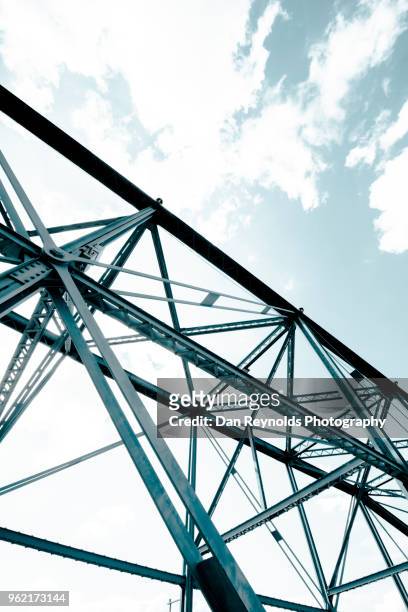 view of steel bridge against light sky - bascule bridge stock pictures, royalty-free photos & images