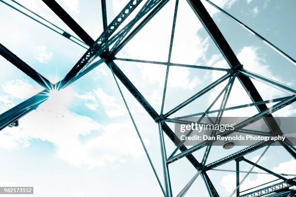 view of steel bridge against light sky - klappbrücke stock-fotos und bilder