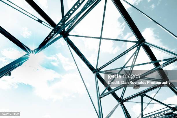view of steel bridge against light sky - bascule bridge stock pictures, royalty-free photos & images