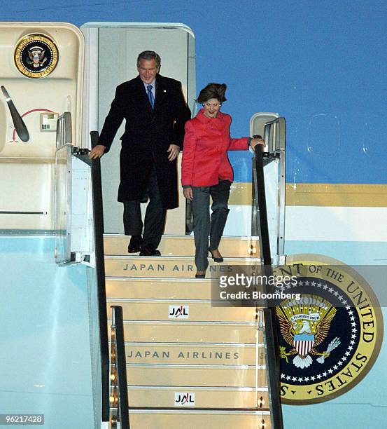 President George W. Bush and First Lady Laura Bush depart from Air Force One upon arrival at Osaka International Airport Tuesday, November 15, 2005....