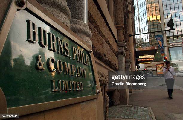 Man walks by Burns Philp & Co.'s offices in Sydney, Australia Monday, November 14, 2005. Bain Capital, the investment firm founded by Massachusetts...
