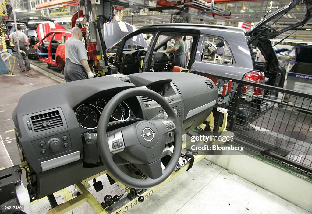 Assembly workers complete Opel Zafira cars at the General Mo