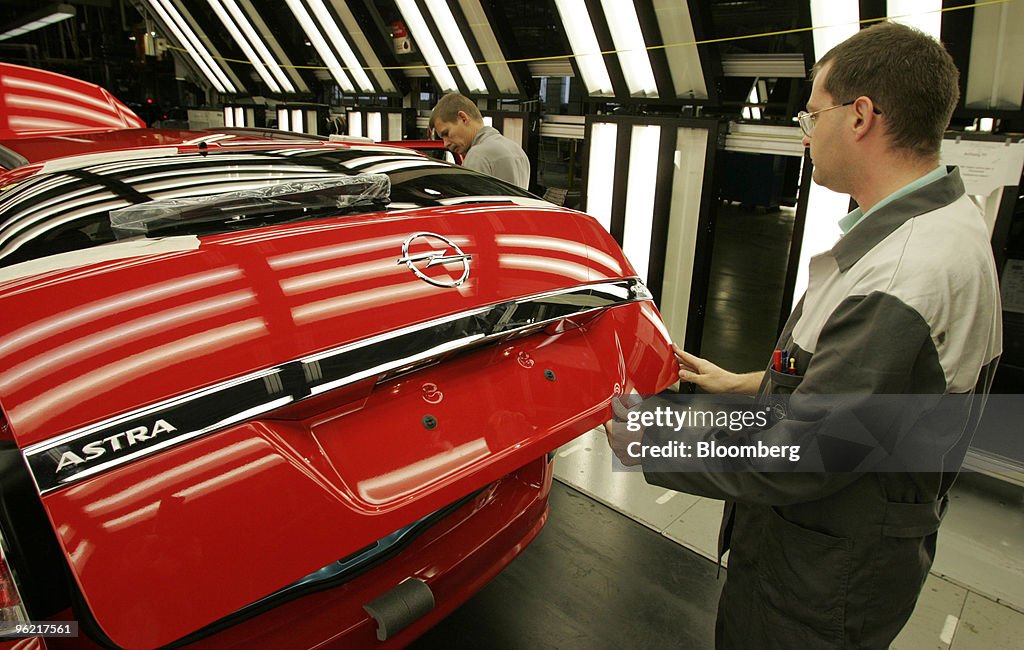 Workers assembles Opel Astra cars at the General Motors plan
