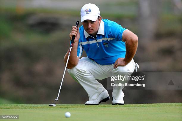 Golfer Graeme McDowell of the European team lines up a 12-foot putt on the 6th hole during a morning foursome match on day two of the 37th Ryder Cup...