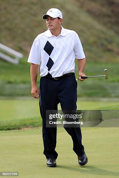 Golfer Ben Curtis of the U.S. Team reacts after missing a birdie putt on the 8th hole during an afternoon four-ball match on day one of the 37th...