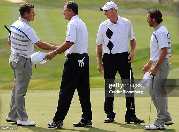 European team members Lee Westwood, left, and Sergio Garcia, right, greet U.S. Team members Kenny Perry, second from the left, and Jim Furyk after...