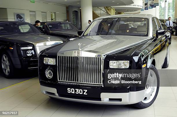 Man drives a Rolls-Royce Phantom at a dealership in Singapore, on Monday, Sept. 15, 2008. Rolls-Royce is a division of Bayerische Motoren Werke AG.