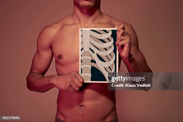 Visable Ribs Man 215 Guy Holding Ribs Stock Photos, High-Res Pictures, and Images ...