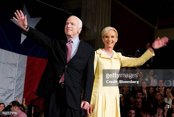 John McCain, U.S. Senator from Arizona and 2008 Republican presidential candidate, and wife Cindy Hensley McCain, wave at a primary night event in...