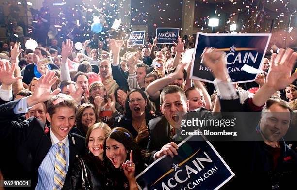Supporters of John McCain, U.S. Senator from Arizona and 2008 Republican presidential candidate, cheer as they wait for election results at a primary...